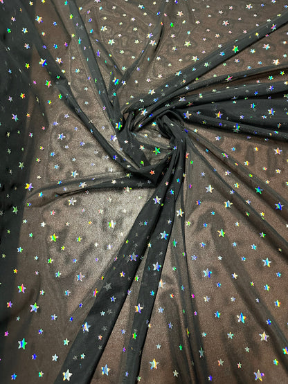 Celestial design hologram stars sequins on power mesh nylon spandex 4-way stretch 58/60” Sold by the YD. Ships worldwide from LA