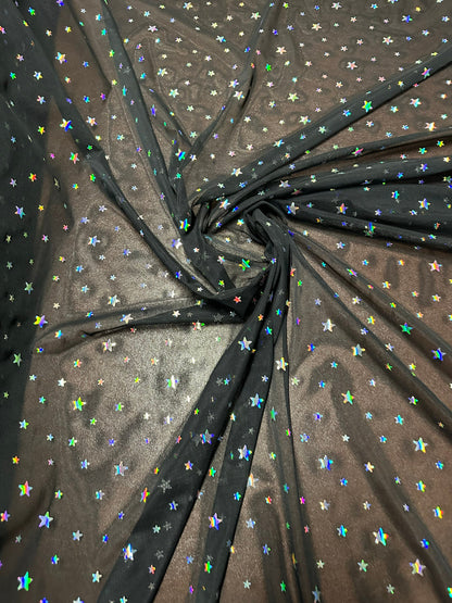 Celestial design hologram stars sequins on power mesh nylon spandex 4-way stretch 58/60” Sold by the YD. Ships worldwide from LA