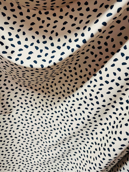 New Baby Dalmatian design print on great quality of nylon spandex 4-way stretch Nude/Black 4-way stretch 58/60” Sold by the YD.