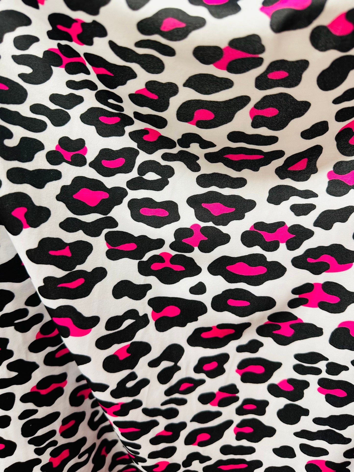 Exotic Leopard design white/Neon pink print on great quality of nylon spandex 4-way stretch 58/60” Sold by the YD. Ships worldwide from LA