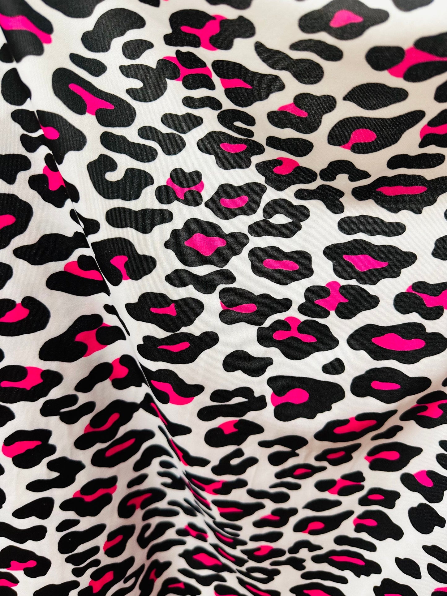 Exotic Leopard design white/Neon pink print on great quality of nylon spandex 4-way stretch 58/60” Sold by the YD. Ships worldwide from LA