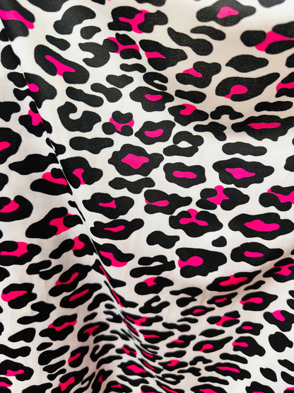 Exotic Leopard design white/Neon pink print on great quality of nylon spandex 4-way stretch 58/60” Sold by the YD. Ships worldwide from LA