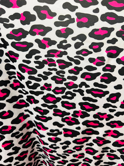 Exotic Leopard design white/Neon pink print on great quality of nylon spandex 4-way stretch 58/60” Sold by the YD. Ships worldwide from LA