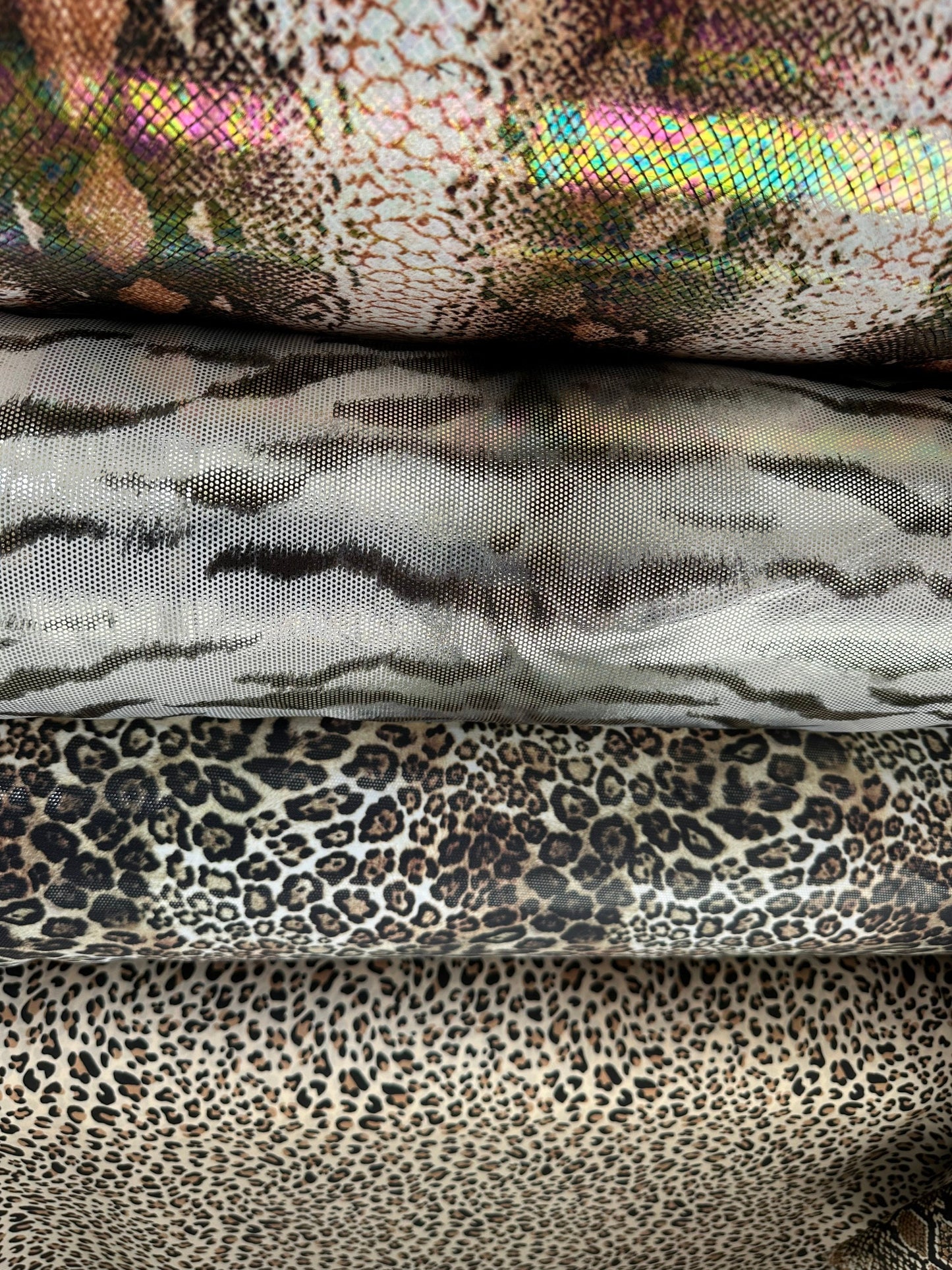 Exotic animal prints metallic nylon spandex with foil 4-way stretch 58/60” Sold by the YD. Ships worldwide from Los Angeles California USA