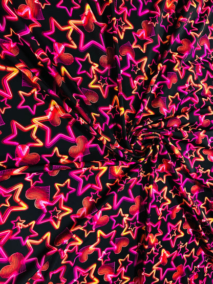 Stars design Black/Pink/Orange luxury design it glows in the dark with black light 4-way stretch nylon spandex 58/60” Sold by the YD.