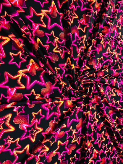 Stars design Black/Pink/Orange luxury design it glows in the dark with black light 4-way stretch nylon spandex 58/60” Sold by the YD.