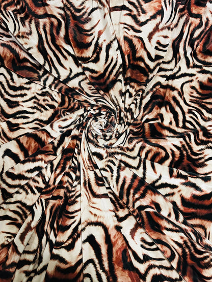 New Exotic Tiger design Natural/Brown print on great quality of stretch velvet 4-way stretch 58/60” Sold by the YD. Ships worldwide from L.A