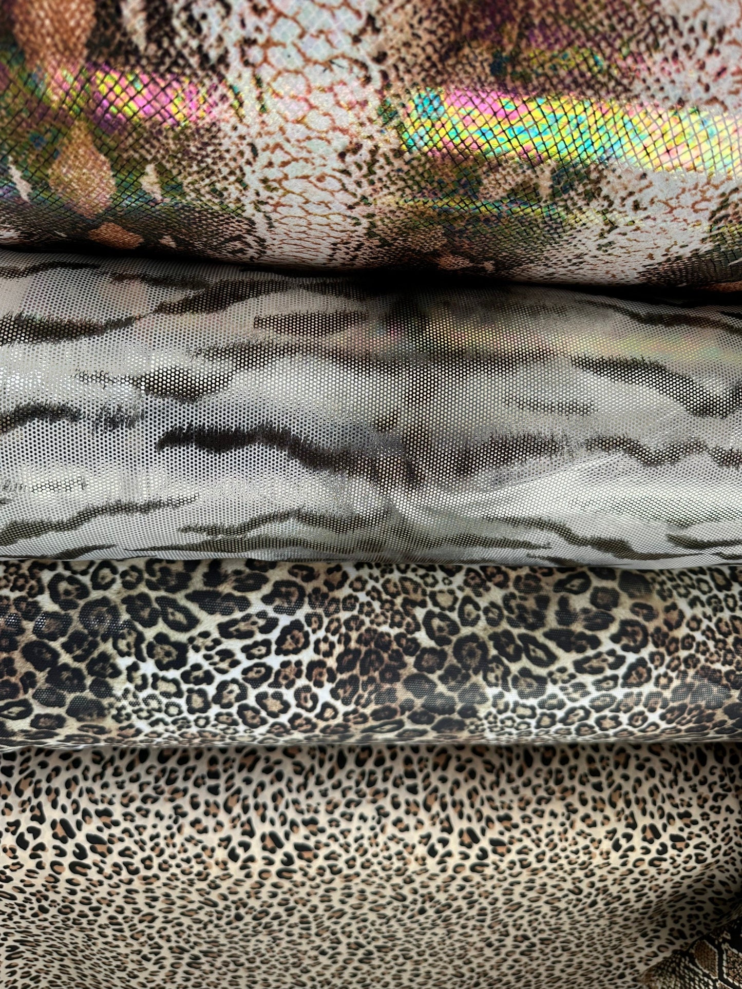 Exotic animal prints metallic nylon spandex with foil 4-way stretch 58/60” Sold by the YD. Ships worldwide from Los Angeles California USA