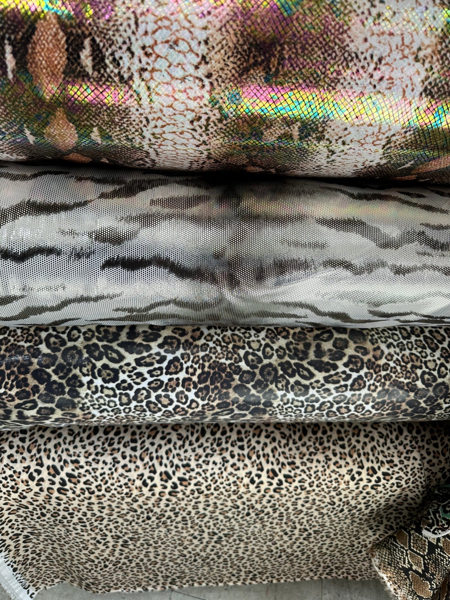 Exotic animal prints metallic nylon spandex with foil 4-way stretch 58/60” Sold by the YD. Ships worldwide from Los Angeles California USA