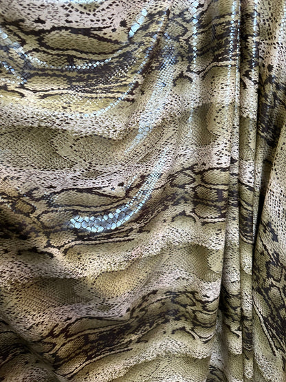 New Snake skin design print on great quality of poly spandex with clear foil 2-way stretch 58/60” Sold by the YD. Ships worldwide from L.A