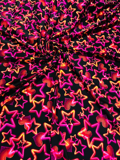 Stars design Black/Pink/Orange luxury design it glows in the dark with black light 4-way stretch nylon spandex 58/60” Sold by the YD.