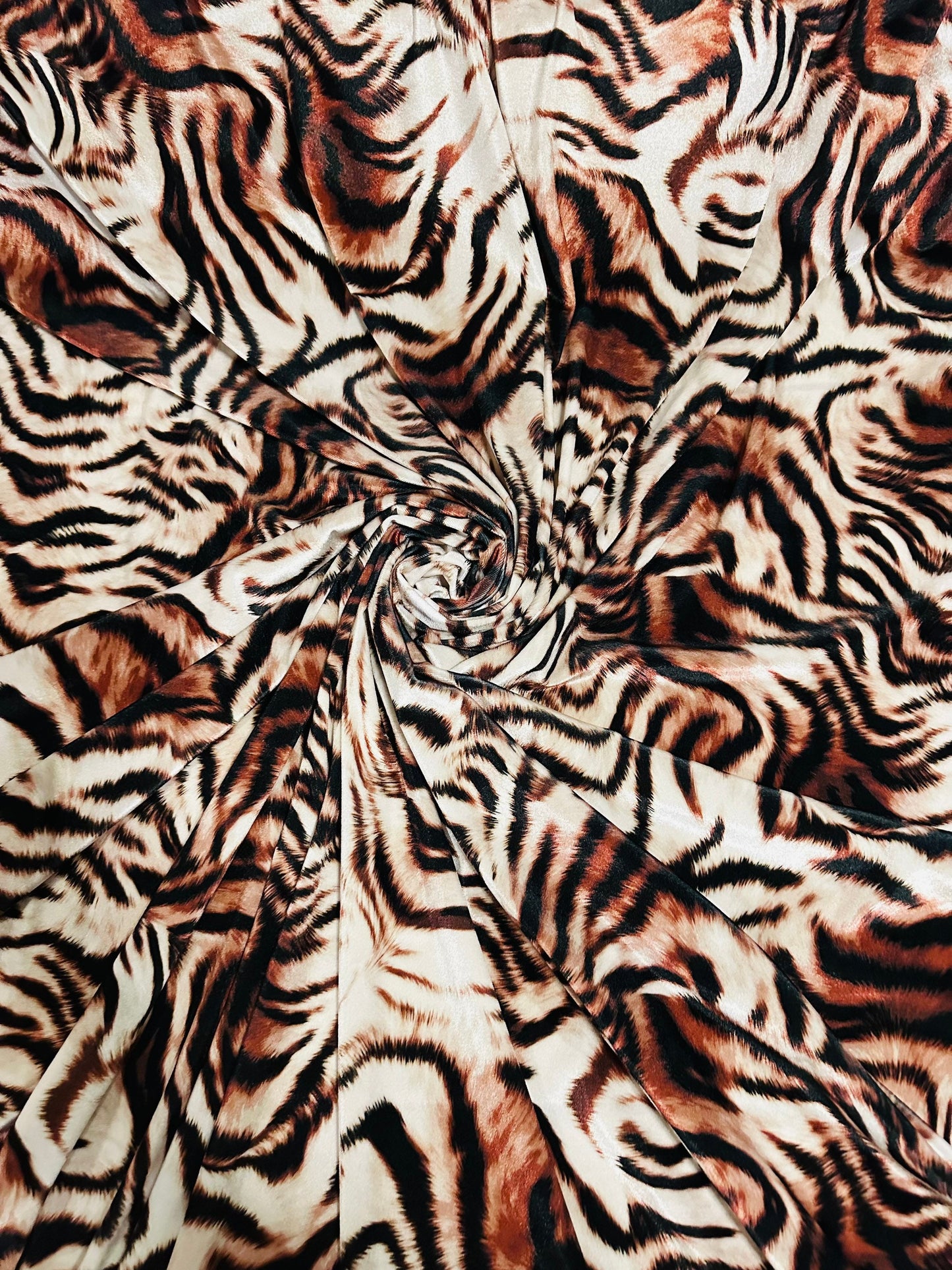 New Exotic Tiger design Natural/Brown print on great quality of stretch velvet 4-way stretch 58/60” Sold by the YD. Ships worldwide from L.A