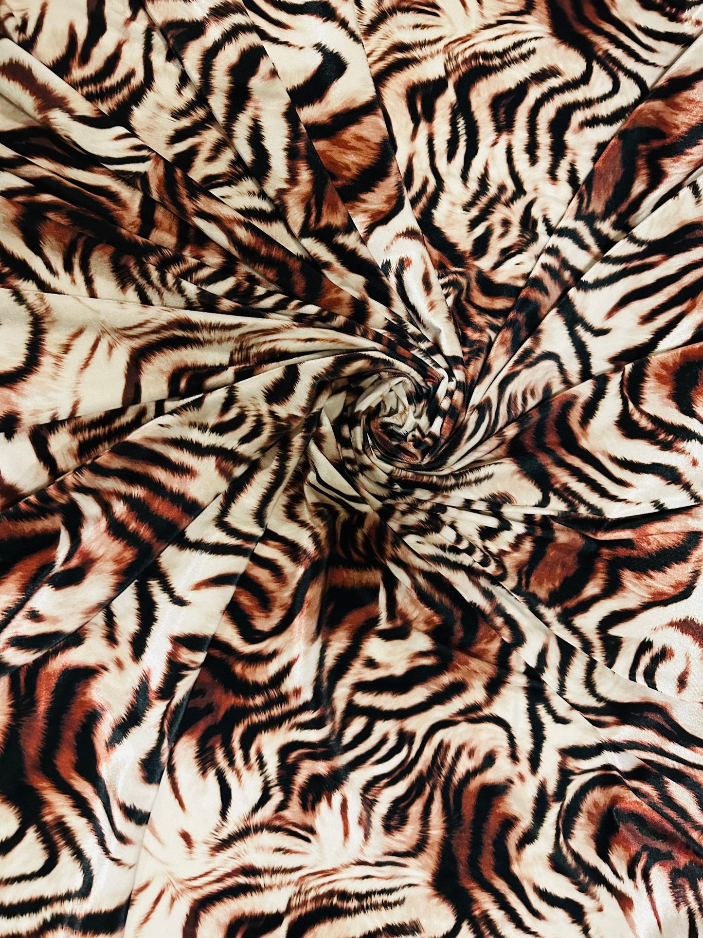 New Exotic Tiger design Natural/Brown print on great quality of stretch velvet 4-way stretch 58/60” Sold by the YD. Ships worldwide from L.A