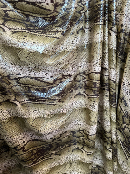 New Snake skin design print on great quality of poly spandex with clear foil 2-way stretch 58/60” Sold by the YD. Ships worldwide from L.A