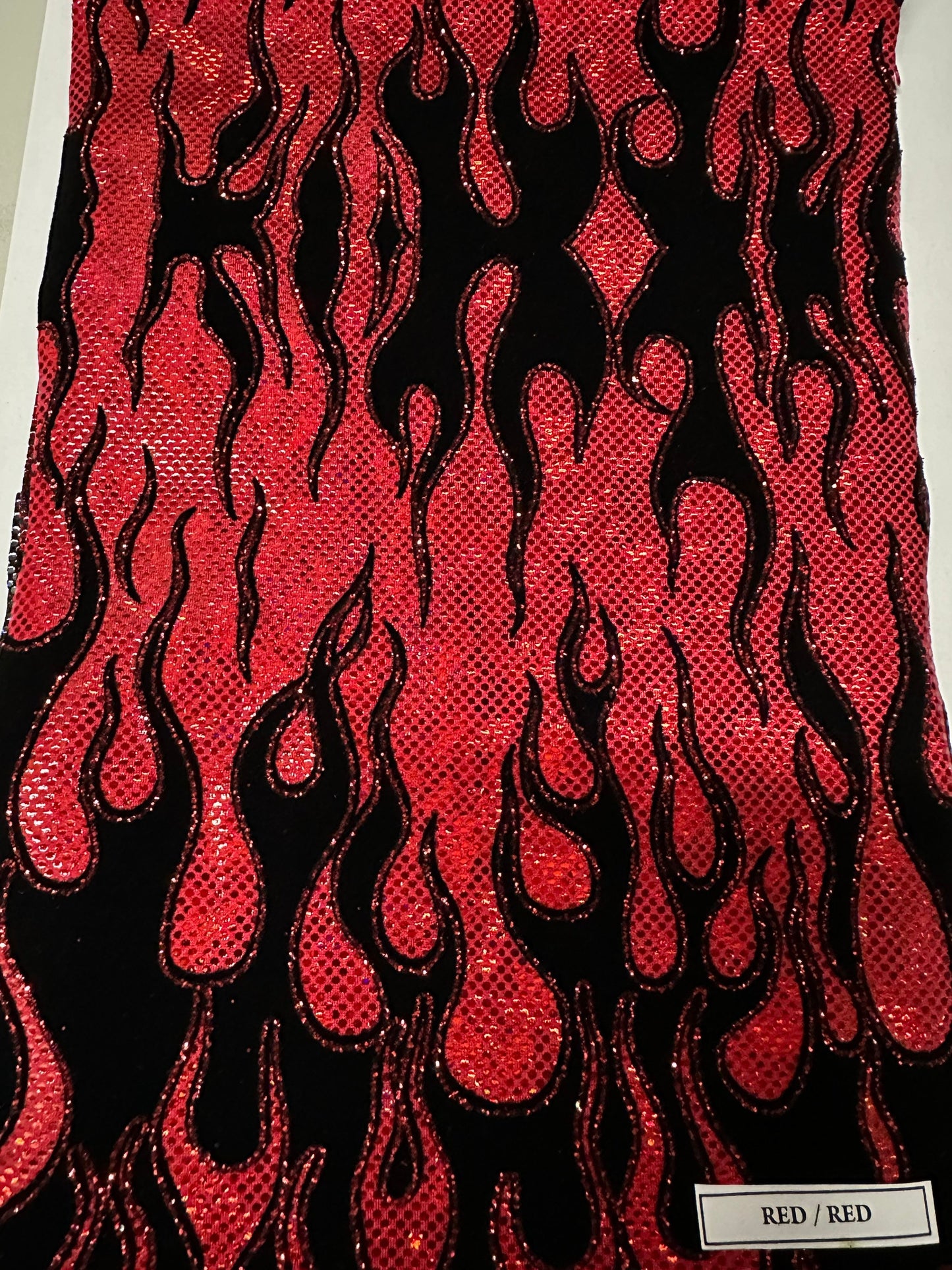 Ghost Rider Flames design hologram shattered glass with flocking metallic nylon spandex 4-way stretch 58/60” Sold by the YD.