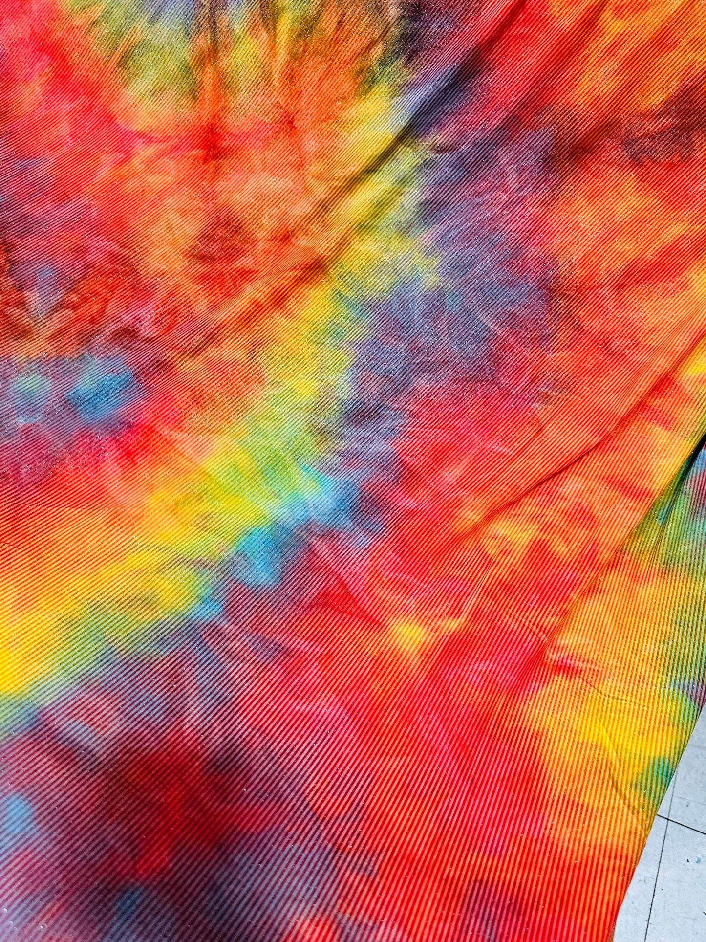 Tie dye rainbow print on great quality of poly spandex 2-way stretch 58/60” Sold by the YD. Ships worldwide from Los Angeles California USA