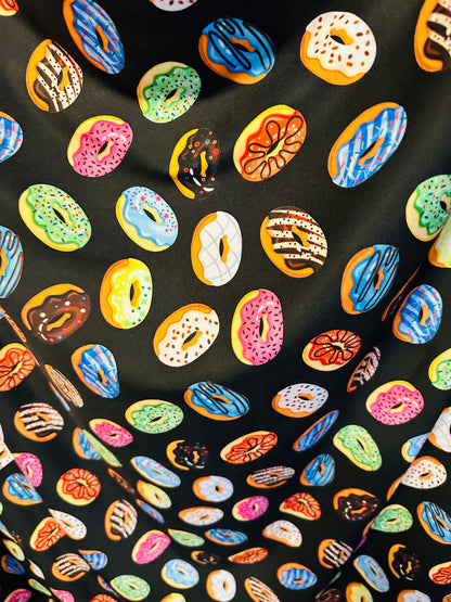 New donuts design Black multicolor print on great quality of nylon spandex 4way Stretch 58/60” Sold by the yd. Ships worldwide from L.A