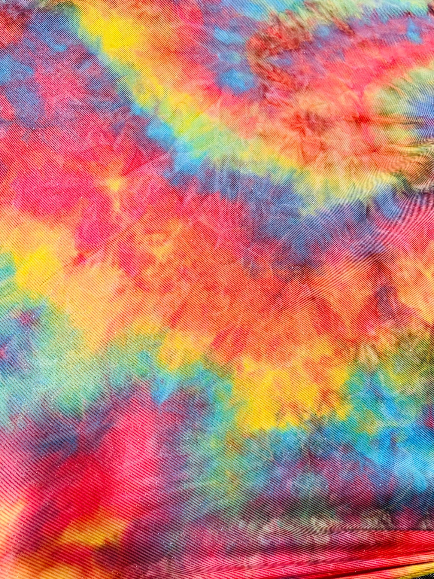 Tie dye rainbow print on great quality of poly spandex 2-way stretch 58/60” Sold by the YD. Ships worldwide from Los Angeles California USA