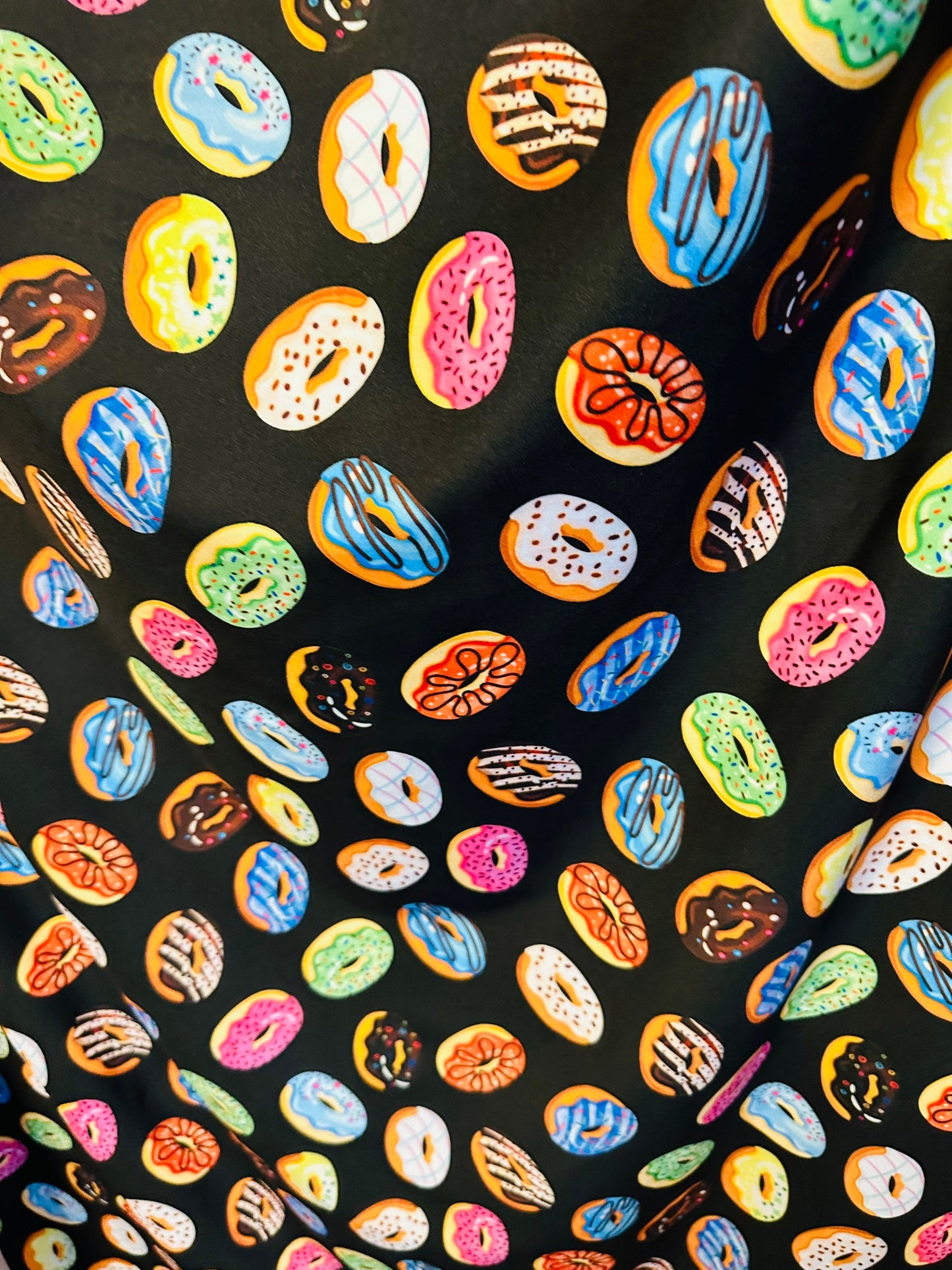 New donuts design Black multicolor print on great quality of nylon spandex 4way Stretch 58/60” Sold by the yd. Ships worldwide from L.A