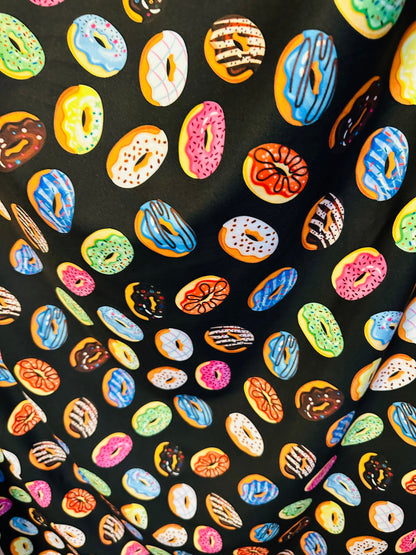 New donuts design Black multicolor print on great quality of nylon spandex 4way Stretch 58/60” Sold by the yd. Ships worldwide from L.A