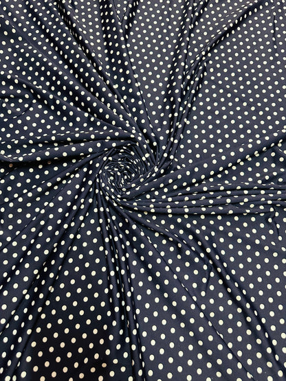 Small dots navy/white print on great quality of nylon spandex 4-way stretch 58/60” Sold by the YD. Ships worldwide from L.A