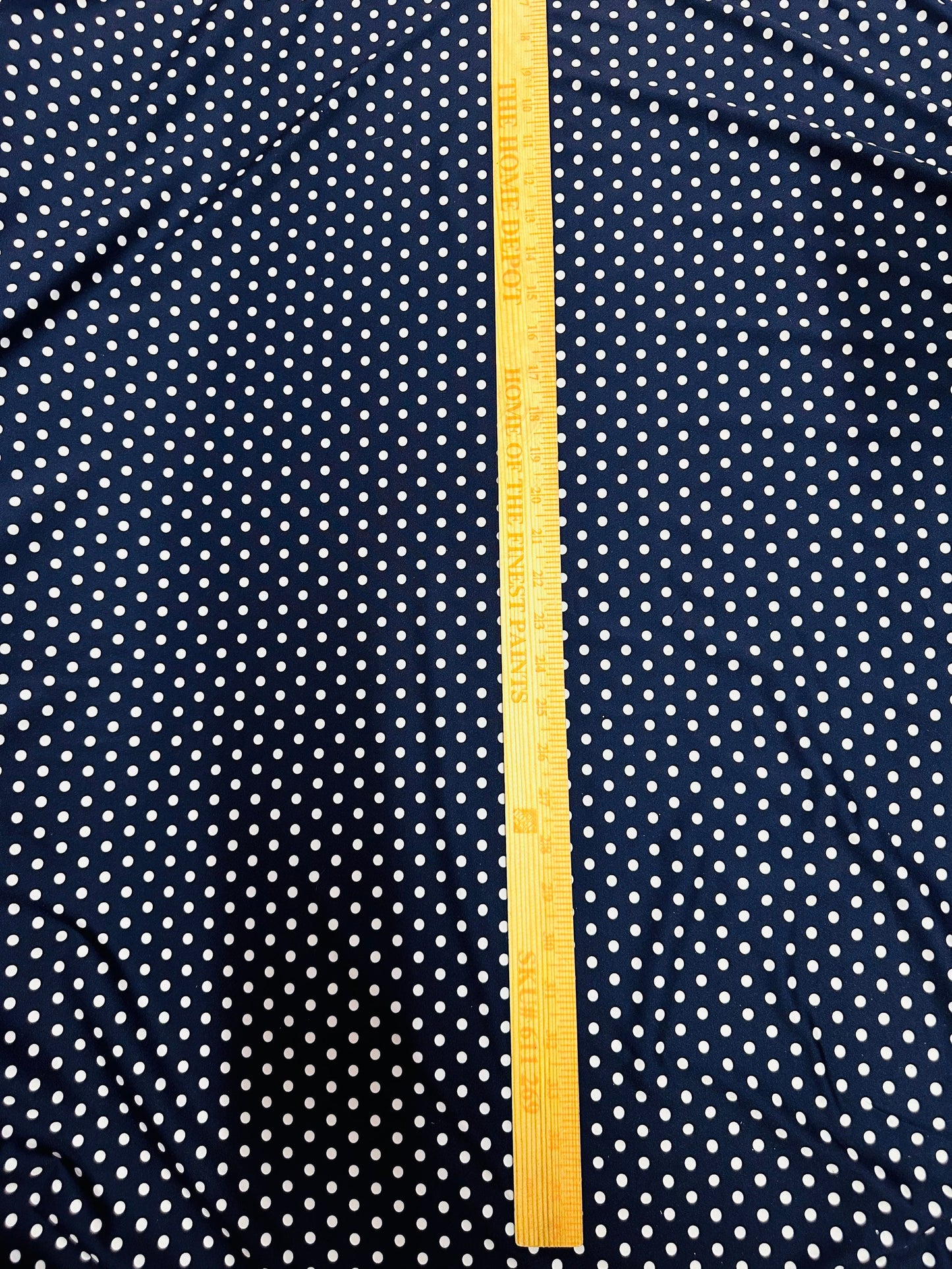 Small dots navy/white print on great quality of nylon spandex 4-way stretch 58/60” Sold by the YD. Ships worldwide from L.A