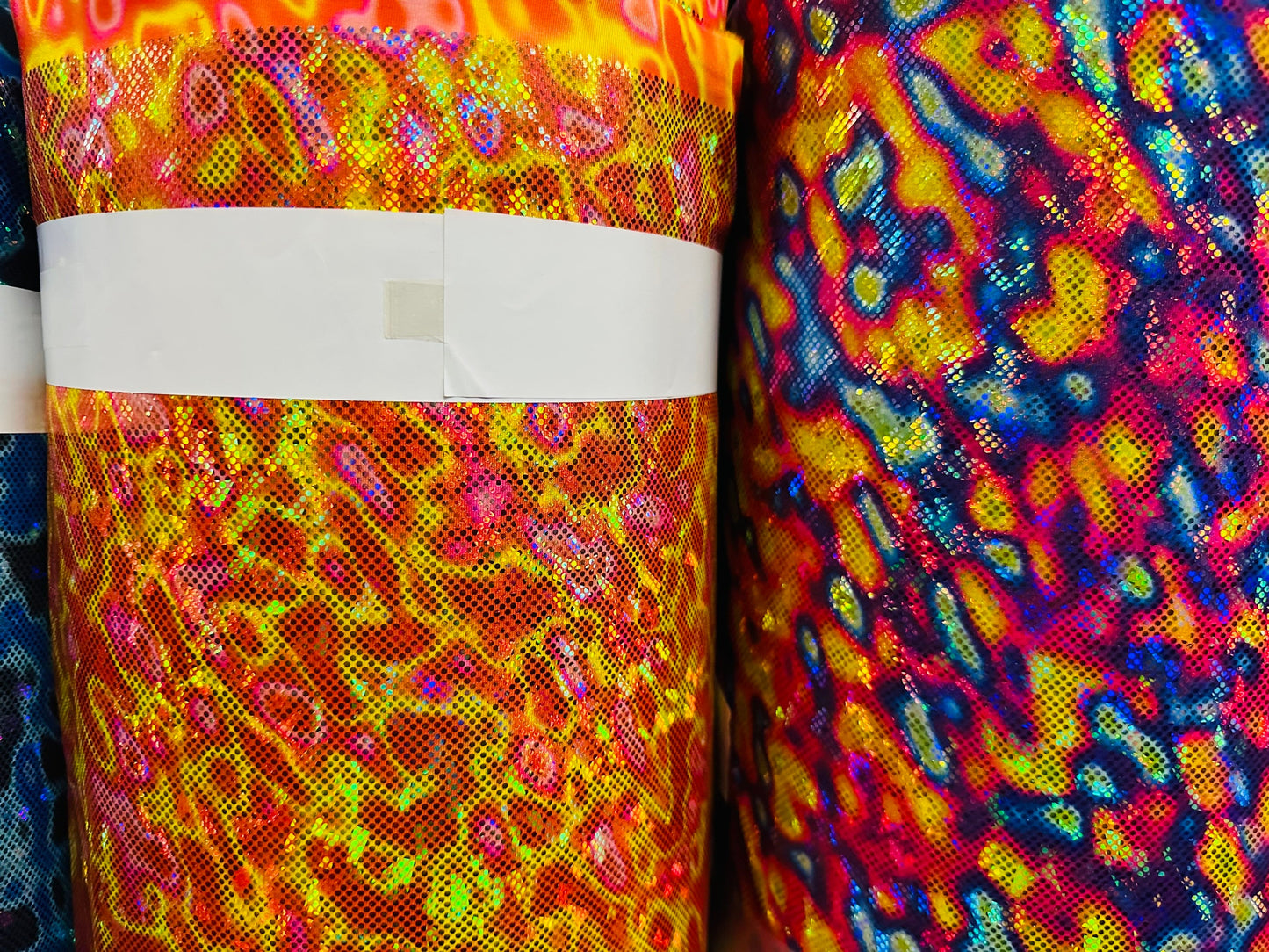 Modern Lava design hologram metallic nylon spandex 4-way stretch 58/60” Sold by the YD