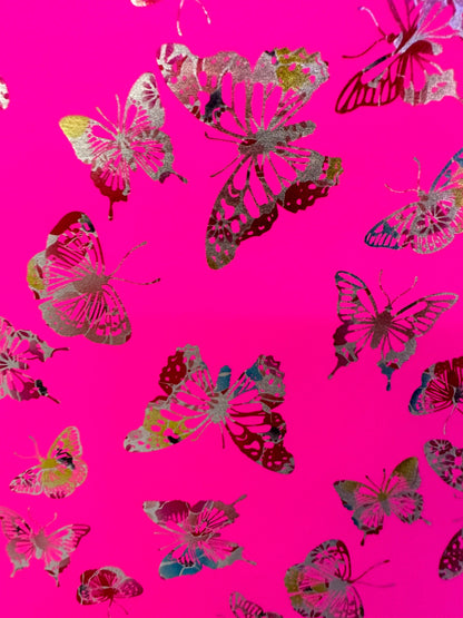 Butterfly design on best quality of nylon spandex 4-way stretch Neon Pink with rainbow foil 58/60” Sold by the YD.