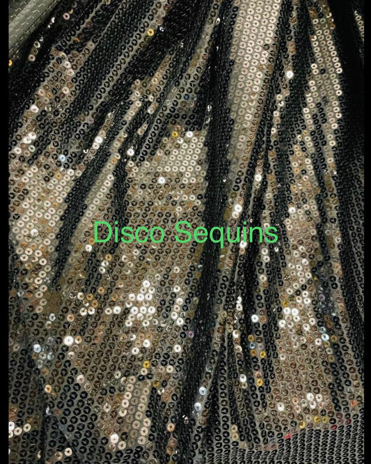 Shiny black sequins 2 designs #1 Disco sequins #2 cosmic glitz sequins both embroidered on stretch mesh 2-way stretch 55/57” Sold by the YD.