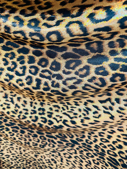 Exotic Jaguar design exotic on hologram metallic nylon spandex with all over Gold/Bronze 4-way stretch 58/60”