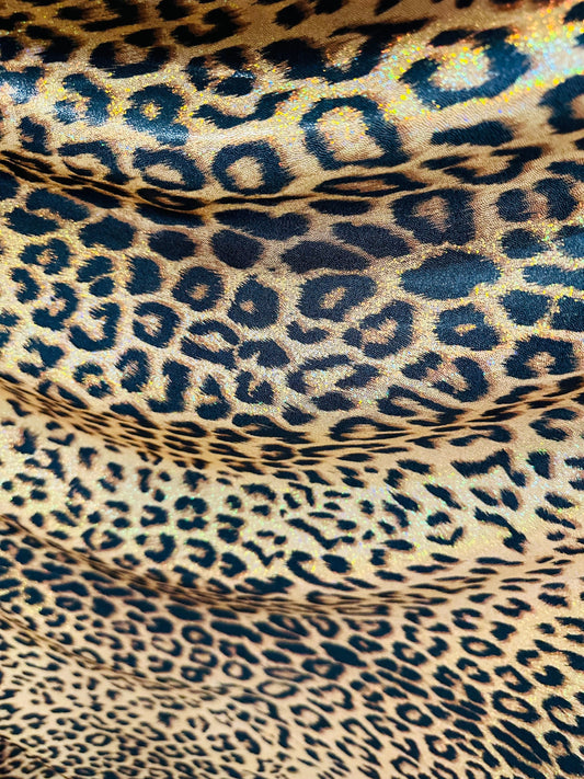 Exotic Jaguar design exotic on hologram metallic nylon spandex with all over Gold/Bronze 4-way stretch 58/60”