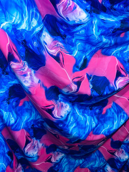 New Liquid Abstract lava design Sapphire/pink print on best quality of nylon spandex 4-way stretch 58/60” Sold by the YD.