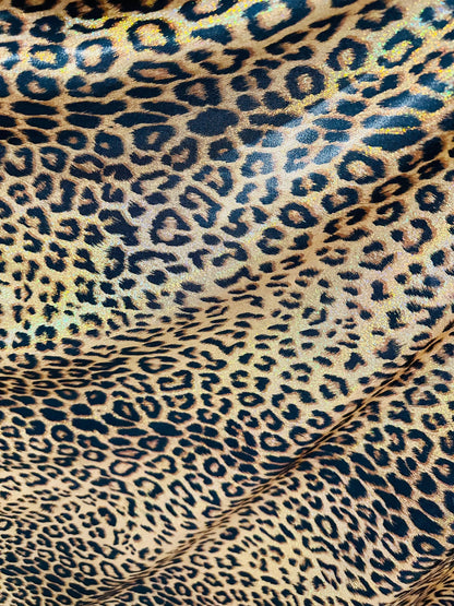 Exotic Jaguar design exotic on hologram metallic nylon spandex with all over Gold/Bronze 4-way stretch 58/60”