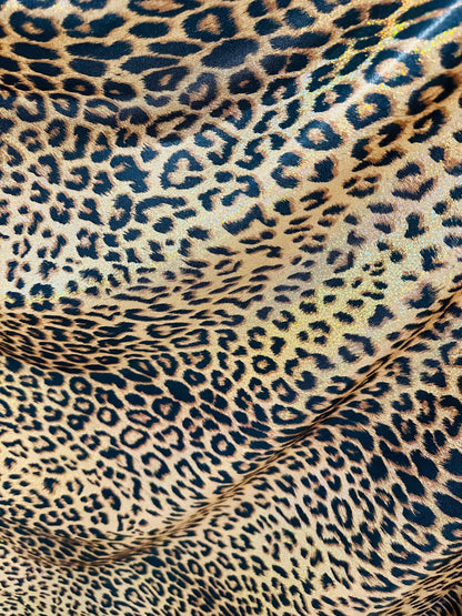 Exotic Jaguar design exotic on hologram metallic nylon spandex with all over Gold/Bronze 4-way stretch 58/60”