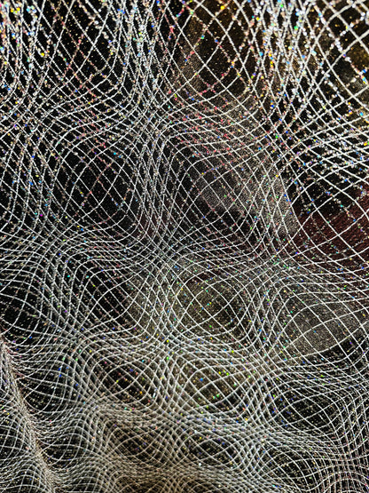 New spiderweb design on metallic poly spandex with glitter 4-way stretch 58/60” Sold by the YD. Ships worldwide from L.A