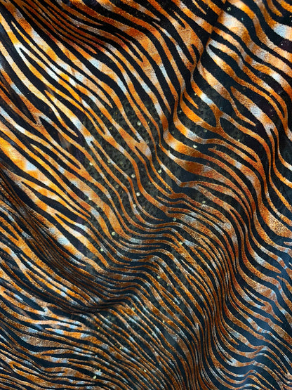 Exotic Zebra design Black/Copper metallic hologram mesh 4-way stretch 58/60” Sold by the YD. Ships worldwide from Los Angeles California USA