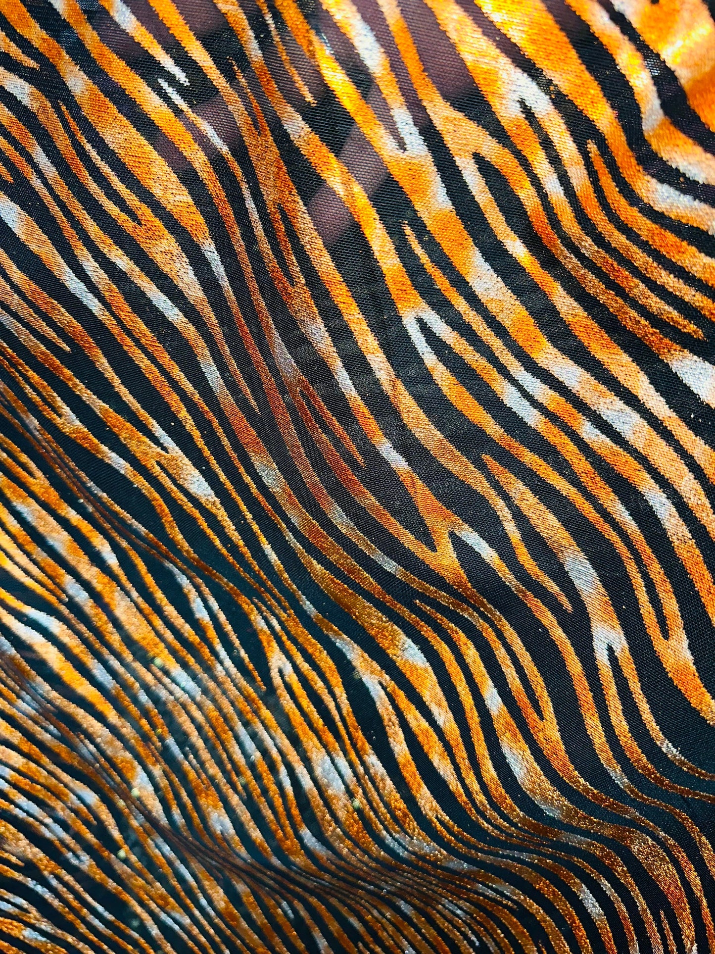 Exotic Zebra design Black/Copper metallic hologram mesh 4-way stretch 58/60” Sold by the YD. Ships worldwide from Los Angeles California USA