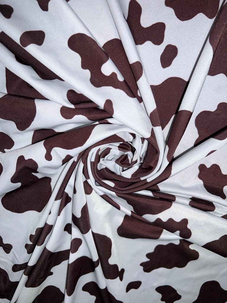 Cow Exotic design print on best quality of nylon spandex 4-way stretch 58/60” Sold by the YD.