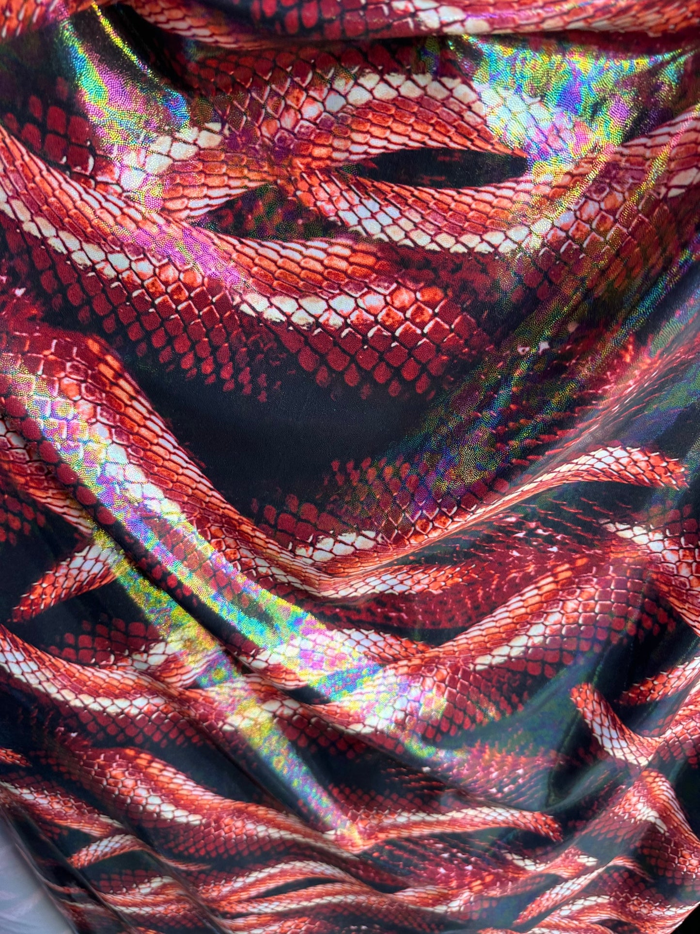 Anaconda Amazon design exotic snake print on great quality of metallic iridescent nylon spandex 4-way stretch 58/60” Sold by the YD.