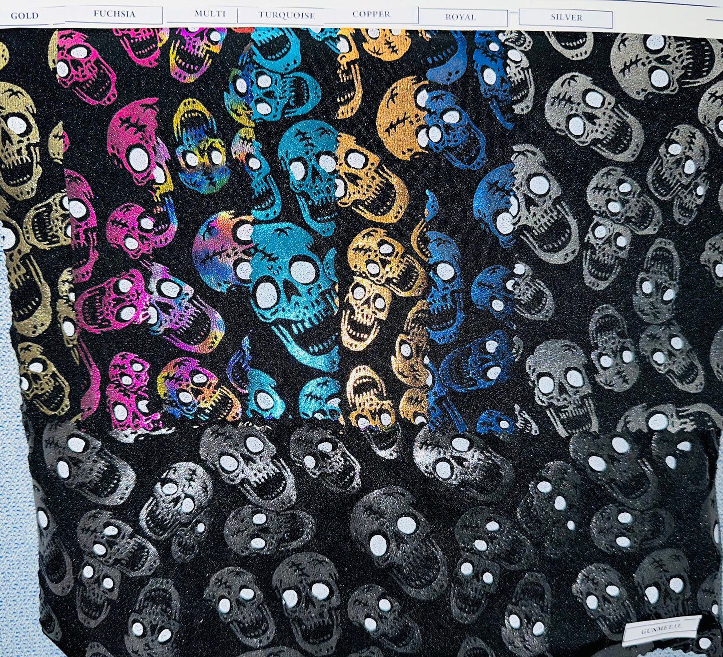 Luxury Laughing skulls design metallic nylon spandex with foil 4-way stretch 58/60” Sold by the YD. Ships worldwide from L.A