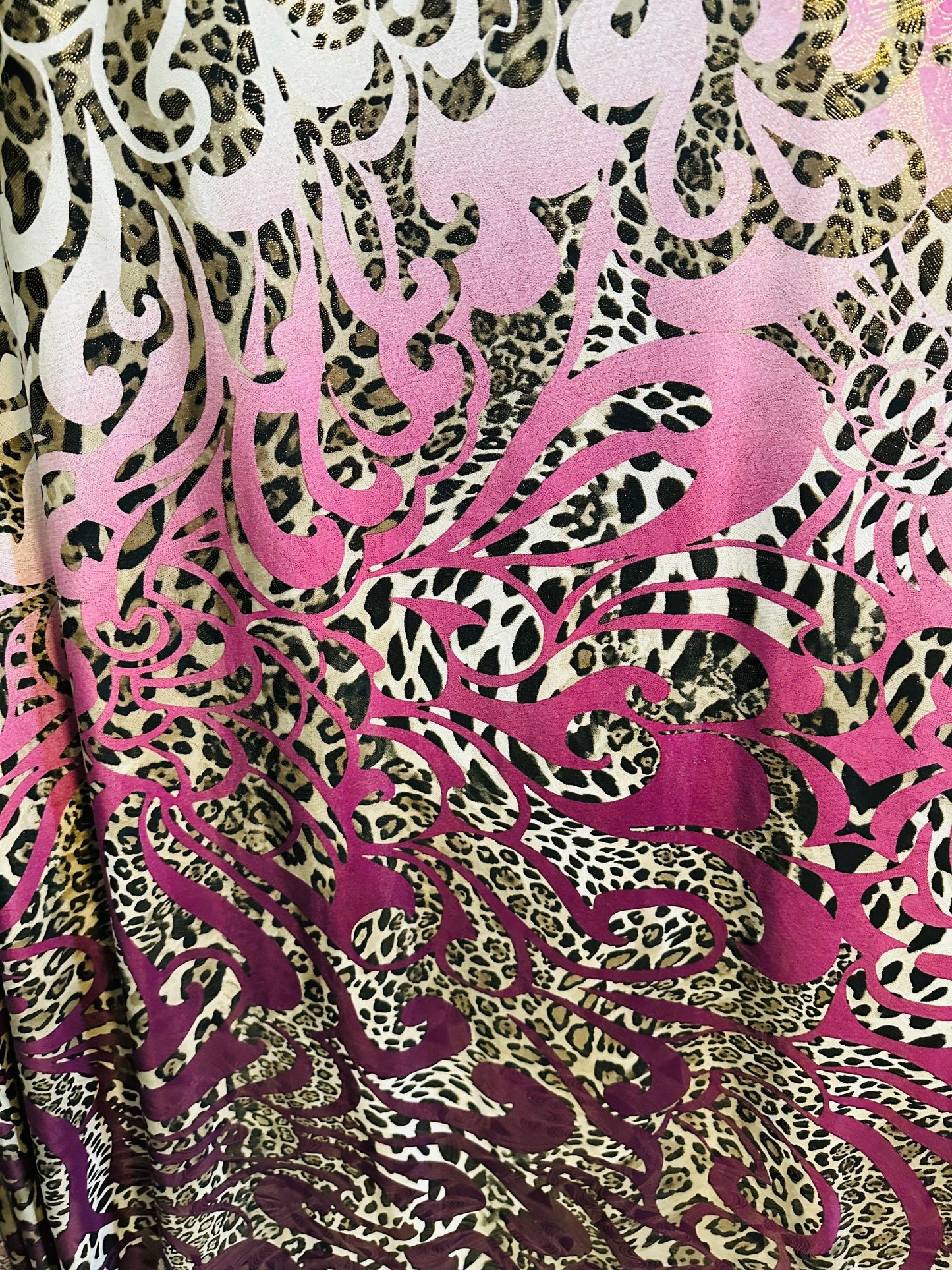 New swirl design with exotic animal print with foil  on poly spandex 2-way stretch 58/60” Medium weight Sold by the YD. Ships Worldwide