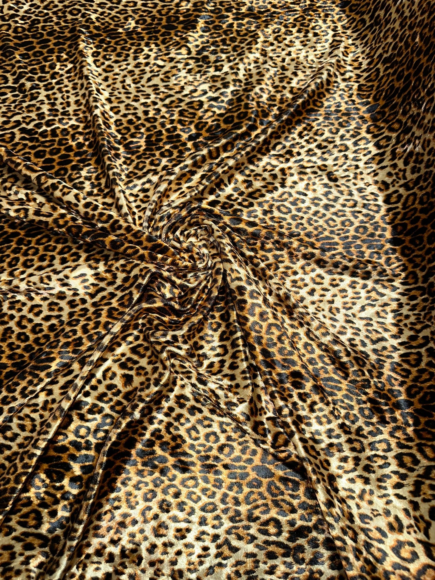 Wild Cheetah design Gold/Brown print on great quality of stretch velvet 4-way stretch 58/60” Sold by the YD.