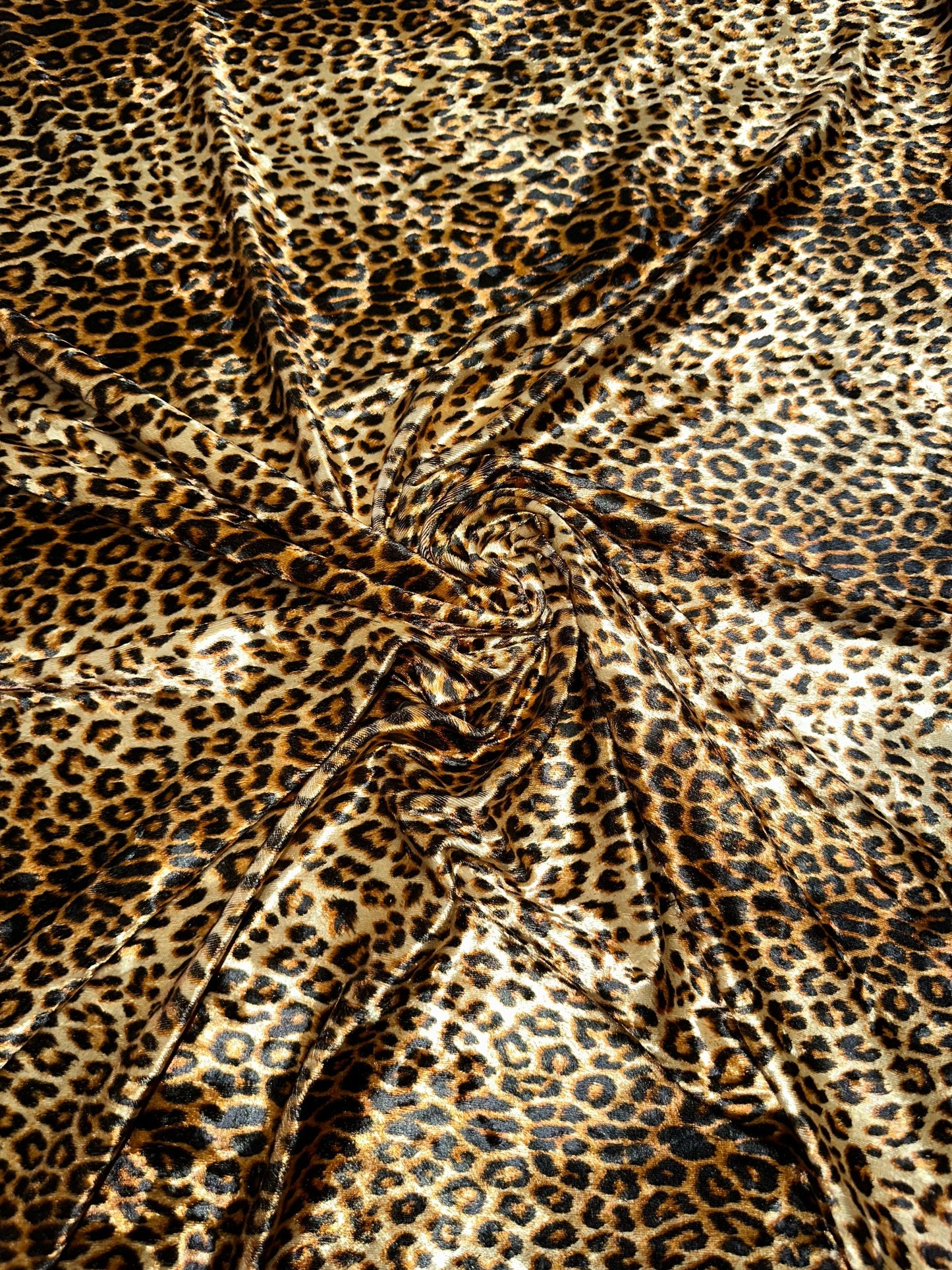 Wild Cheetah design Gold/Brown print on great quality of stretch velvet 4-way stretch 58/60” Sold by the YD.