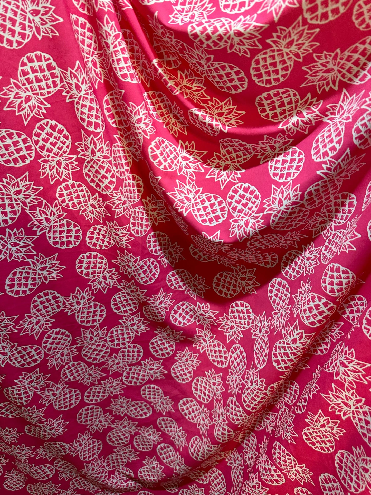 Tropical Pineapple design pink/white print on best quality of nylon spandex 4-way stretch 58/60” Sold by the YD.