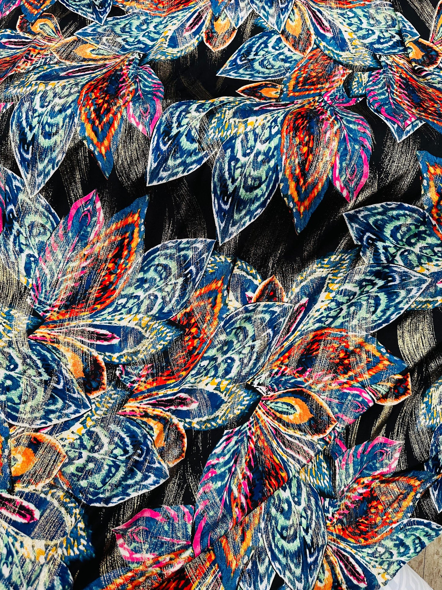 New Feathers design on metallic poly spandex 2-way stretch 58/60”