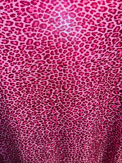 Wild Cheetah design on foggy foil  hologram metallic nylon spandex 4-way stretch 58/60” Sold by the YD. Ships worldwide