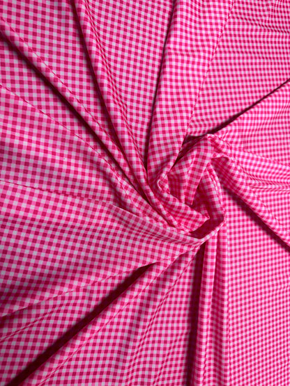 Gingham design 1/4” Hot pink color print on great quality of nylon spandex 4-way stretch 58/60”