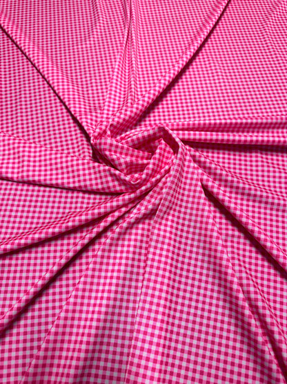 Gingham design 1/4” Hot pink color print on great quality of nylon spandex 4-way stretch 58/60”