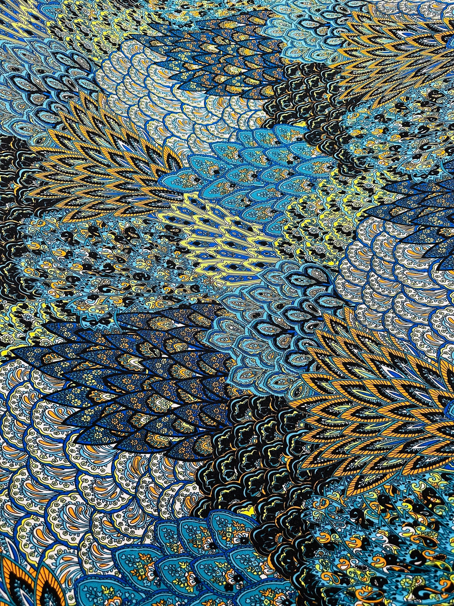 Peacock abstract design print on great quality of poly spandex medium weight 4-way stretch 58/60” Sold by the YD.