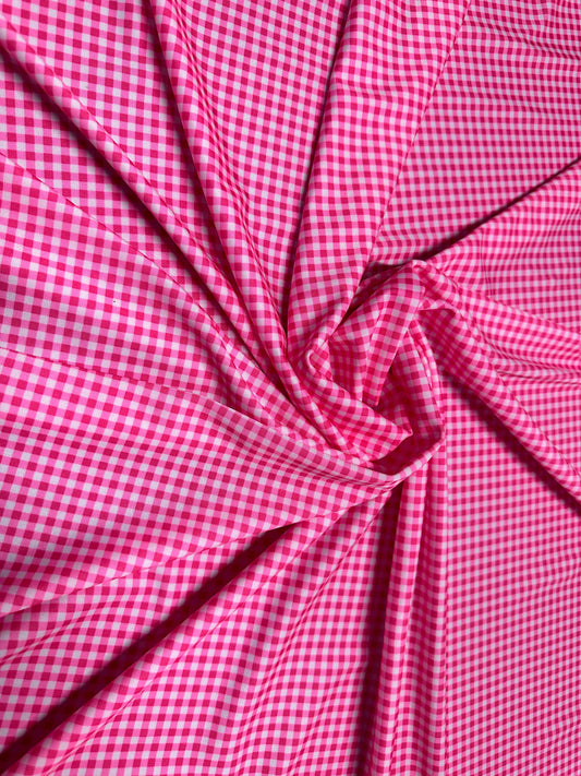 Gingham design 1/4” Hot pink color print on great quality of nylon spandex 4-way stretch 58/60”